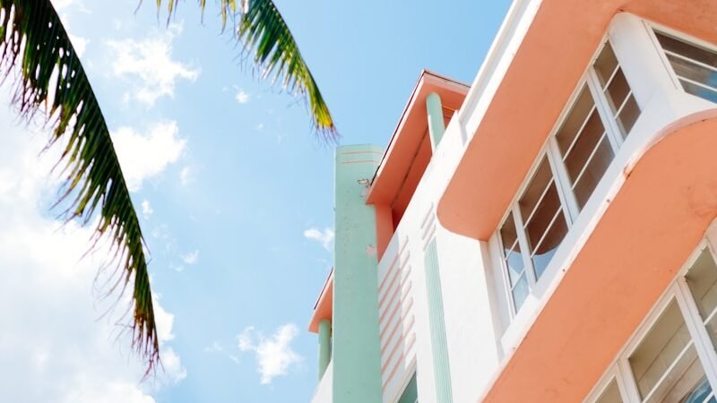 low angle photo of white and orange concrete building
